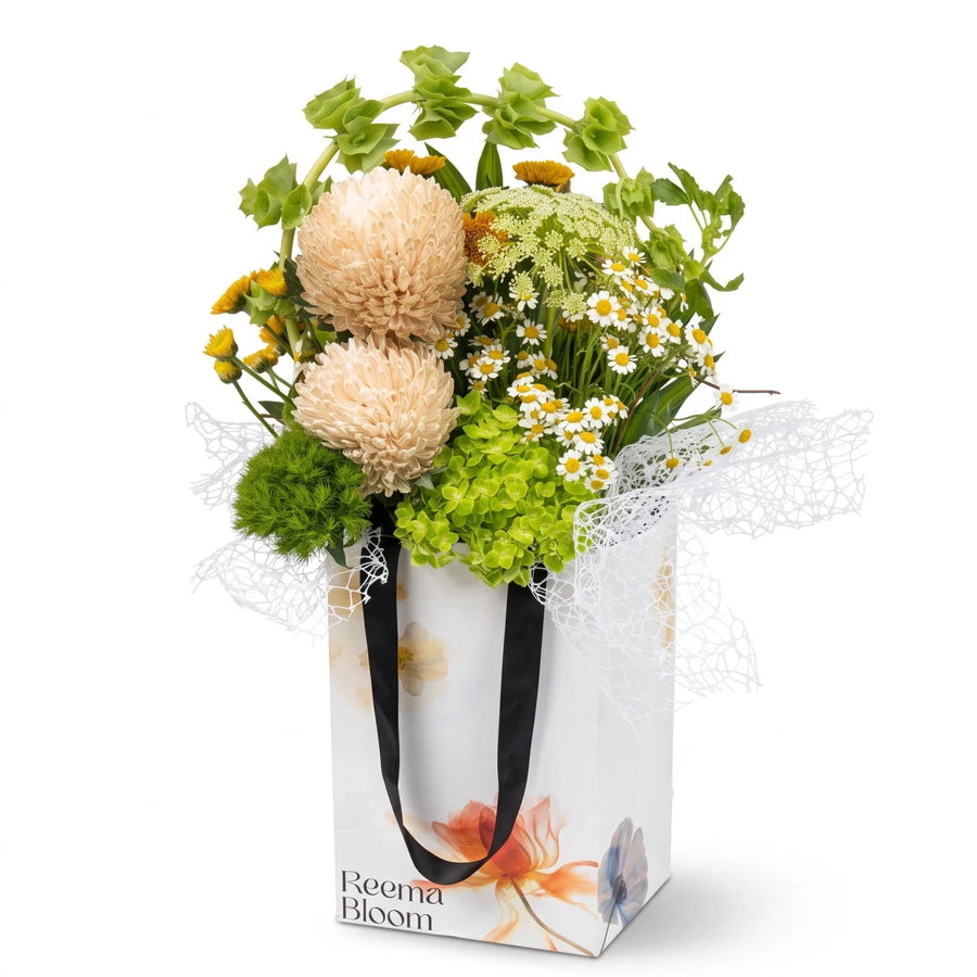 Reema bloom Flower Box – Mixed White, Yellow and Orange Floral Arrangement with Greenery