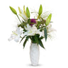 Reema Bloom Flower in Vase – White Lily Blooms, Purple Flowers and Green Foliage