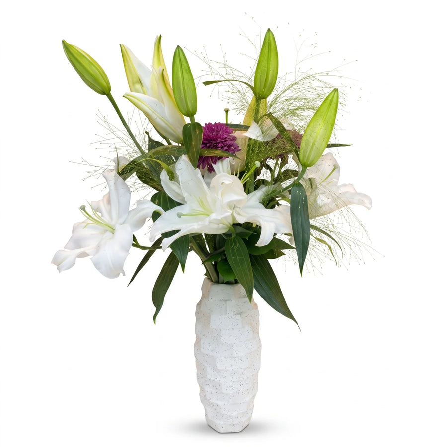 Reema Bloom Flower in Vase – White Lily Blooms, Purple Flowers and Green Foliage