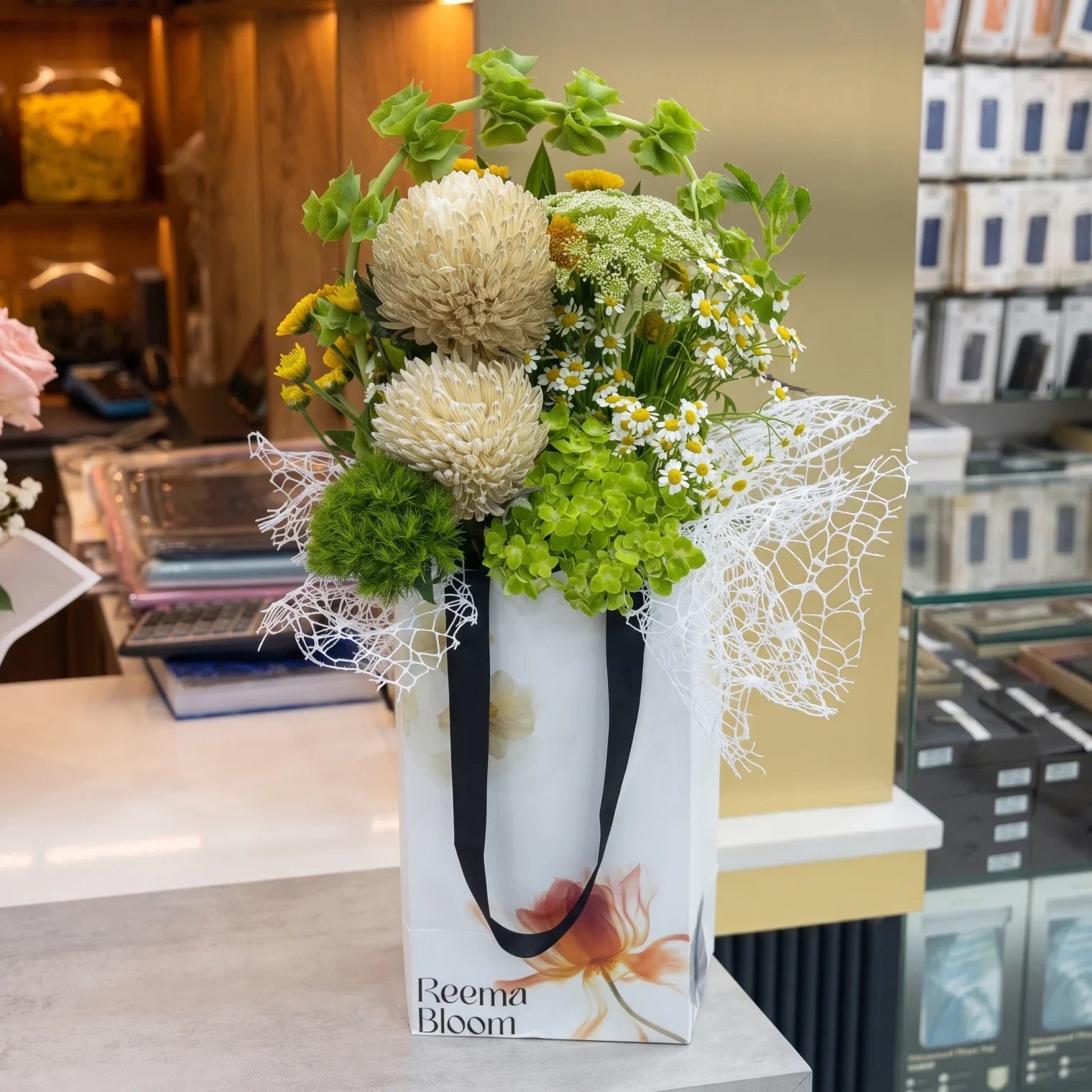 Reema bloom Flower Box – Mixed White, Yellow and Orange Floral Arrangement with Greenery